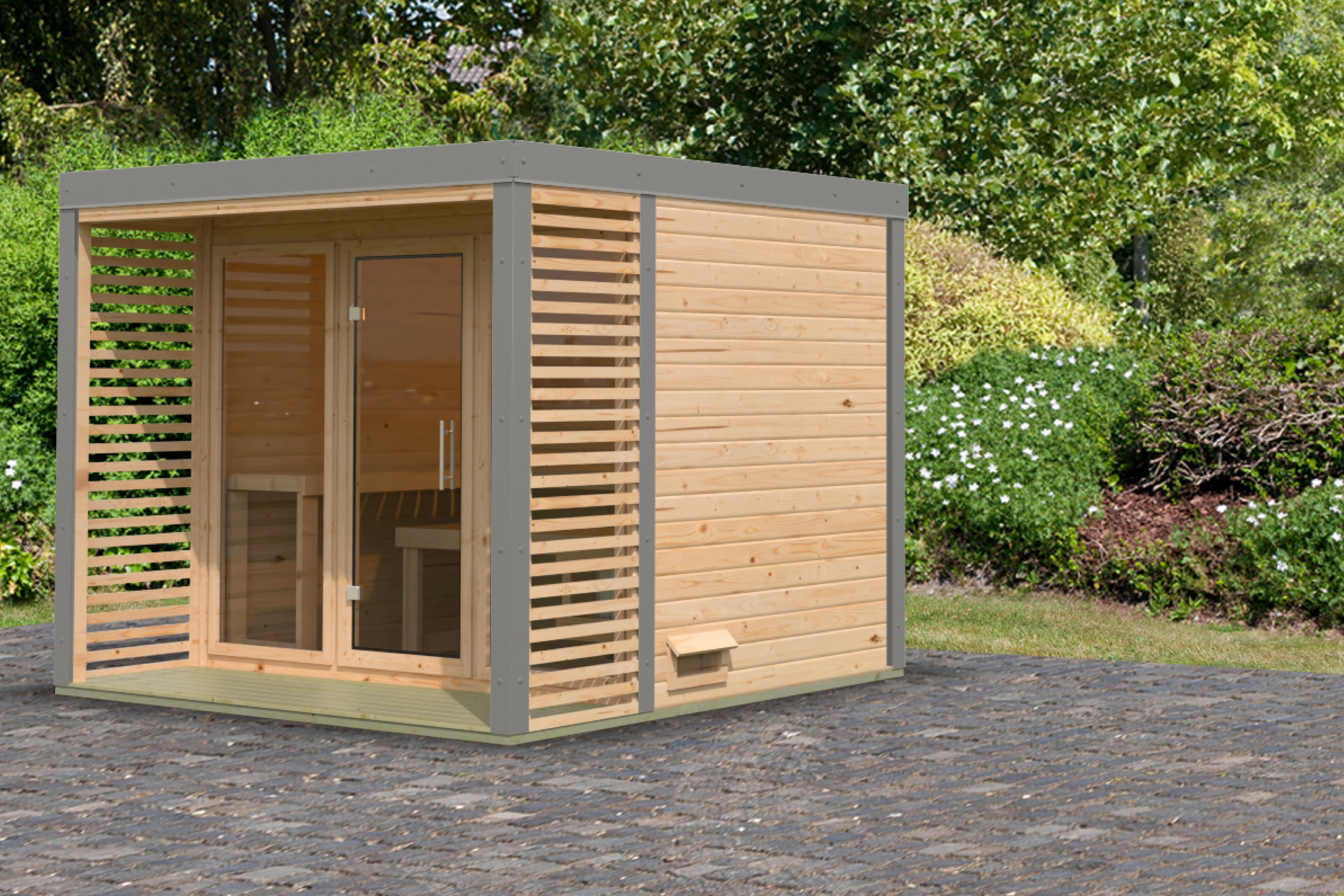 Karibu Saunahaus Ares 3 als Gartensauna aus Massivholz im Garten mit Glasfront