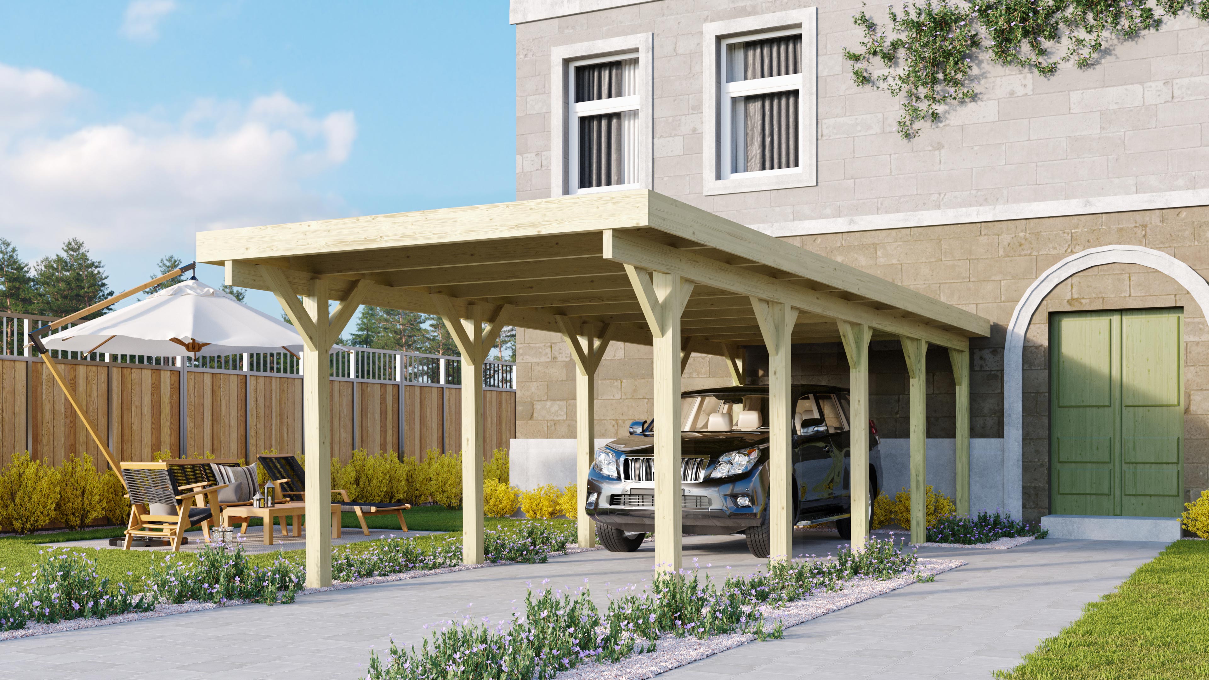 Karibu Einzelcarport Classic 3 aus KDI-Massivholz im Garten aufgebaut als stimmungsvolle Ambiente-Ansicht